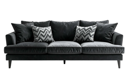 A luxurious, gray velvet sofa with pillows against a black background