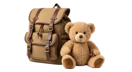 A cuddly brown teddy bear sits next to a stylish tan canvas backpack with brown leather straps.