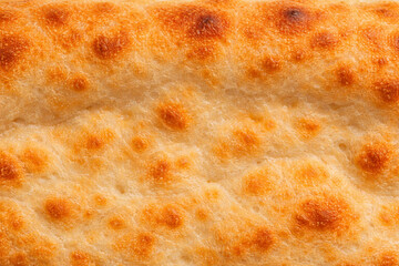 ピザ生地のクラストのマクロ質感背景