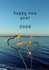 welcome the new year 2026 with sparklers at the beach