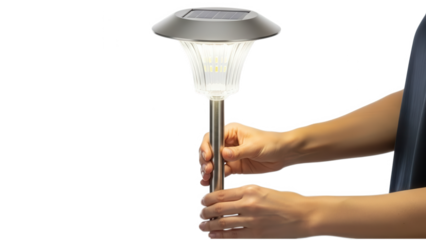 A person holding a modern solar powered garden light on transparent background