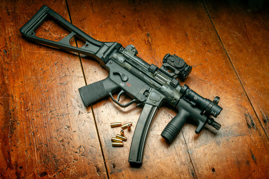 Heckler and Koch SP5K PDW. Limited edition Cerakote paint, Aimpoint T-2 Micro Red dot, Surefire Mini Scout pro light and Federal 147 grain hollow point ammunition.