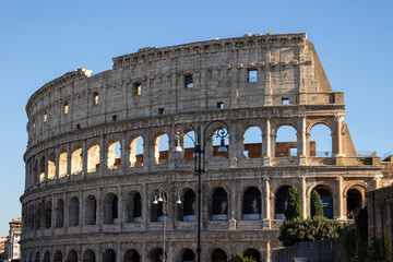 Fototapeta premium Many tourists visit the Colosseum, also known as the Flavian Amphitheater from the time of the Roman Empire, built in the 1st century, located in Rome, Italy.