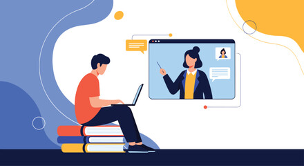 Young man sitting on a stack of books while attending an online class on his laptop with a female tutor on the screen.