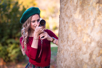 Pretty woman with vintage video camera