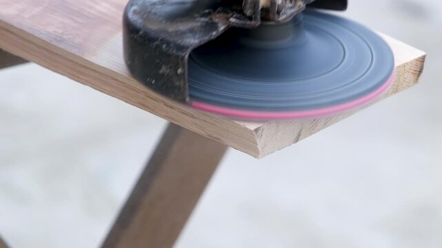sander polishing wood with high pitched sound. Power tool used to smooth surfaces by abrasion with sandpaper
