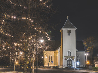 Dr&oslash;bak church illuminated at night during winter