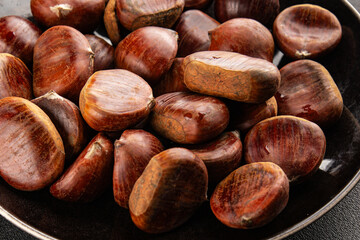 Obraz premium Edible chestnuts delicious treat tasty snack fresh gourmet food background on table rustic food top view copy space