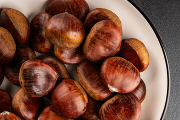 Obraz premium Edible chestnuts delicious treat tasty snack fresh gourmet food background on table rustic food top view copy space