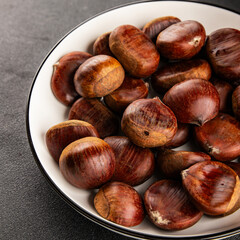 Obraz premium Edible chestnuts delicious treat tasty snack fresh gourmet food background on table rustic food top view copy space