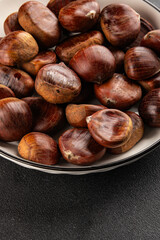 Obraz premium Edible chestnuts delicious treat tasty snack fresh gourmet food background on table rustic food top view copy space