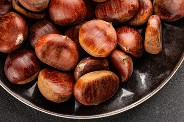 Obraz premium Edible chestnuts delicious treat tasty snack fresh gourmet food background on table rustic food top view copy space