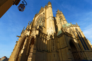 View on the beautiful illuminated cathedral in Metz at sunny day . The construction took three centuries to complete the cathedral, which was consecrated in 1552.