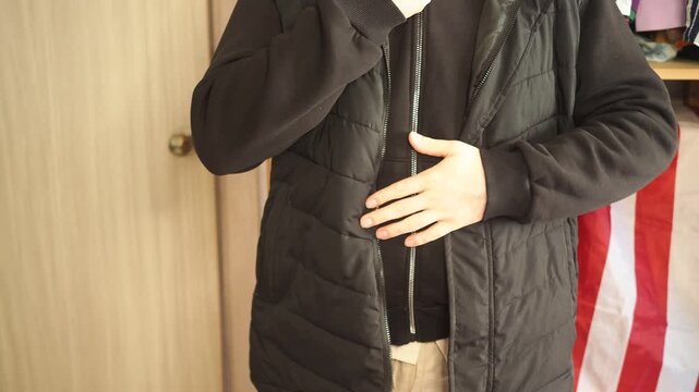 a man gets dressed and gets ready for work early in the morning