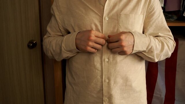 a man gets dressed and gets ready for work early in the morning