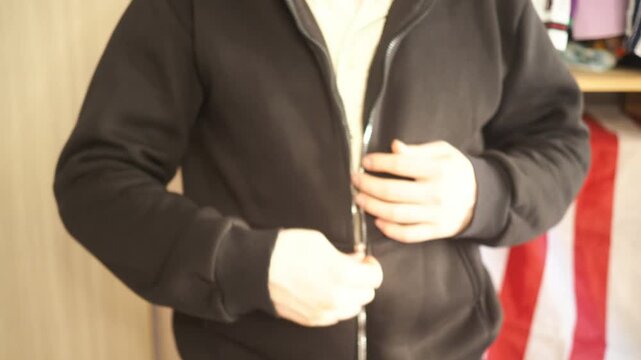 a man gets dressed and gets ready for work early in the morning