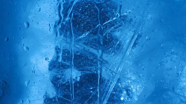 A video showcasing a close-up view of ice with a unique texture and pattern. use as multipurpose tittle intro, gaming background. product mockup. motion graphics background