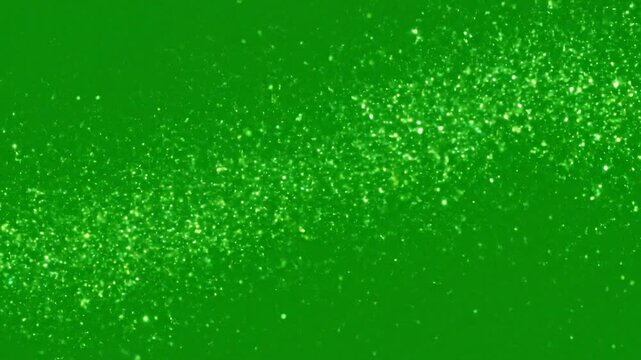 A radiant cascade of luminous green particles scattered across a deep emerald background, creating a mesmerizing textured effect for digital art and festive overlays