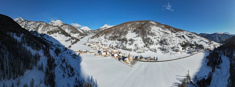 180 &deg; panorama, Arvieux, mountain village in the Queyras in winter, Hautes-Alpes, France, aerial photo by drone