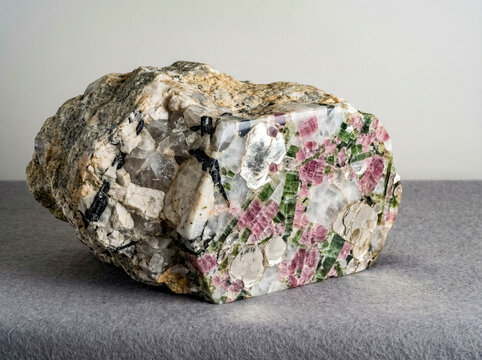 Coarse grained pegmatite specimen containing pink tourmaline lepidolite and quartz