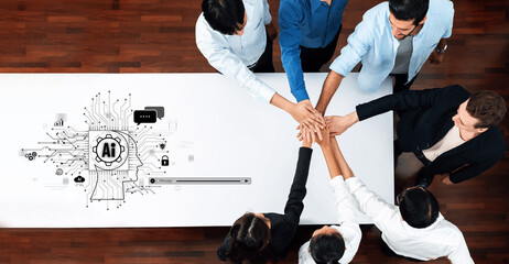 A diverse team collaborates in a modern office setting, showcasing unity and strategic planning with technology elements. Perfect for business and teamwork concepts. Trope