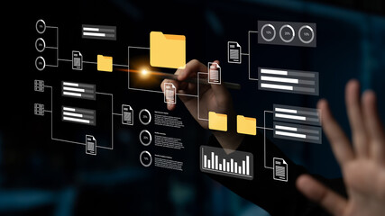 A person interacts with a digital interface displaying data management concepts through visual graphics, highlighting modern technology role in workspace organization and productivity. Gantry