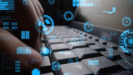 A close-up shot of hands typing on a keyboard, surrounded by digital data visualizations and technology overlays in a modern workspace environment, illustrating innovation. Xenic