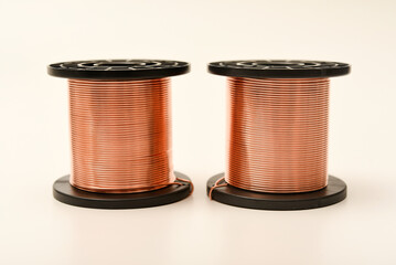 Copper coils on a white background. Copper wire for electronics. Pure copper.
