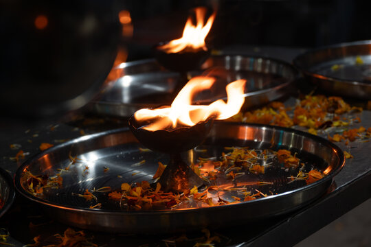 Lightened diya lamps with flower petals in a thali after ganga aarti in Rishikesh, India.