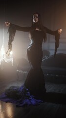 Gothic femme fatale portrait featuring a woman in black godet dress with corseted waist, long straight hair, and dramatic makeup in opulent dimly lit gothic surroundings.
