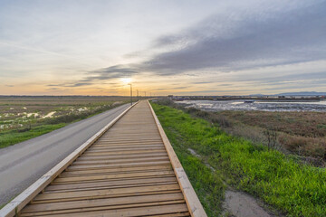 Carrasqueira palafitic port boardwalk at sunset in alcacer do sal