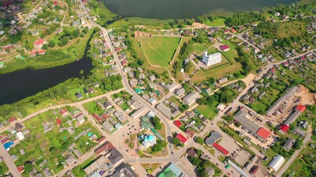 Aerial 4K video from a drone of the city of Ludza. In the background, the Ludza Medieval Castle, the city's churches, and lakes are visible on a sunny summer day. Ludza, Latgale, Latvia. 