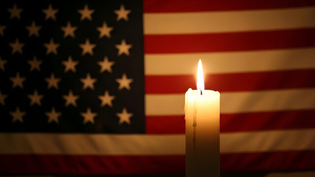 American flag with a lit candle on national day