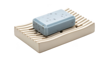 A blue soap bar on a beige soap dish with slats isolated on transparent background