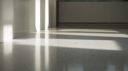 Sunlight streams through vertical blinds, creating patterns on the speckled floor. Minimalist interior design features clean lines and shadows, highlighting architectural details.