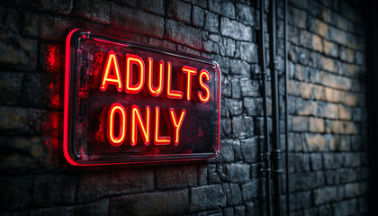 Red neon sign with text adults only glows brightly on brick wall at night. Illuminated nightlife sign signals club or bar entry