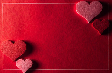 A beautiful red textured background with heart shapes framing a central space for romantic messages or content