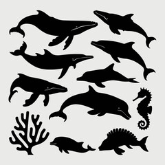 Collection of various marine animals including whales, dolphins, seahorse, fish, and coral in black silhouette style