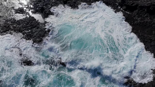 Volcanic Hydro-Explosion: 4K View of the Atlantic Ocean Surging Through the Basaltic Blowholes of El Bufadero de la Garita, Gran Canaria, Canary Islands, Spain