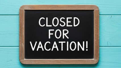 Chalkboard sign announces "CLOSED FOR VACATION!" on a blue wooden background