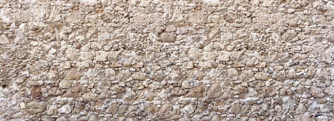 Old rough stone wall with masonry texture background © Kornienko Alexandr