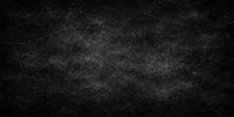 Fototapeta premium A dark grunge black and white texture featuring an old dirty concrete wall pattern with a blank vintage chalkboard surface for an empty grey stone backdrop design