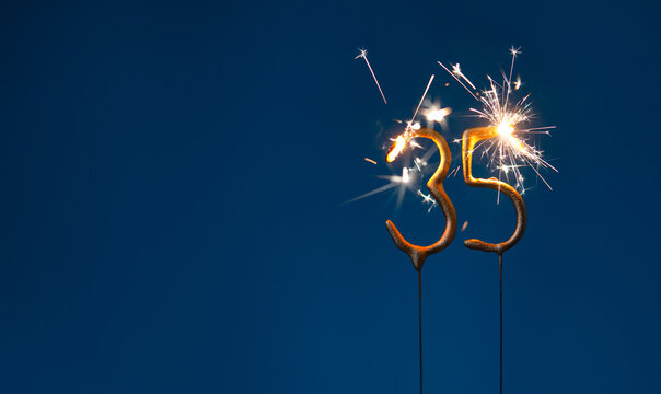 35 years anniversary celebration festive background made with Bengal fires in the form of number Thirty five