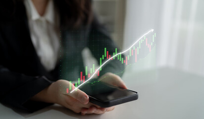 A business professional engages with stock market data on a smartphone, featuring a dynamic financial graph overlay, in a contemporary office setting. Impute