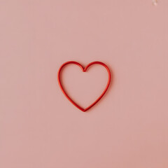 Red heart shape on pink background