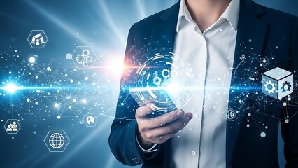 A person in a dark blue suit holding a glowing digital interface with interconnected gears and white shirt
