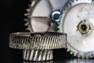 Worn plastic gears and cogs with food grade lubricant, showing texture and mechanical details