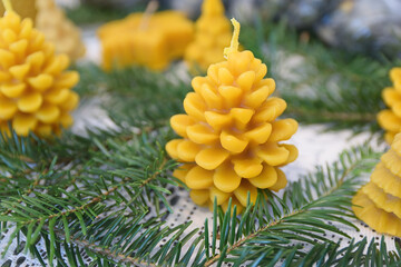 Natural beeswax candles as an eco-friendly interior decoration for Christmas New Year and wintertime.