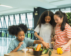Group three children prepare healthy meal together in bright, modern kitchen. Surrounded fresh vegetable like bell pepper broccoli carrot engage in fun and education cook activity. creating vibrant