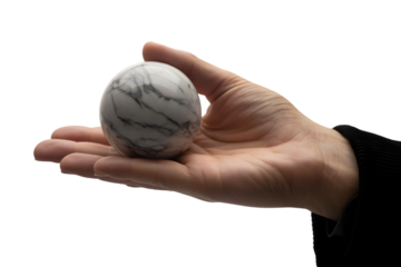 Human hand gently holding a marble sphere . Isolated on transparent background, png